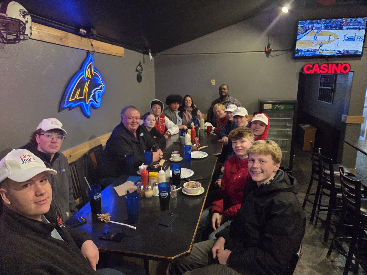 A group of campaign volunteers gathered together at a table.